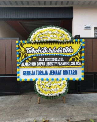 Papan Bunga Duka di Kedamaian